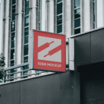Outdoor View of a Sign on Building Mockup