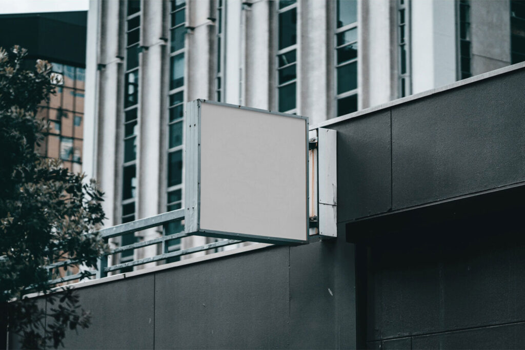 Outdoor View of a Sign on Building Mockup