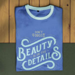 Overhead View of Folded T-shirt on Wooden Texture Mockup