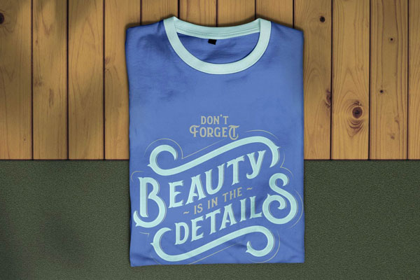 Overhead View of Folded T-shirt on Wooden Texture Mockup