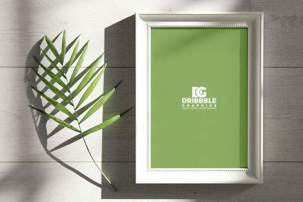 Overhead View of Photo Frame Next to a Branch Mockup