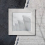 Overhead View of Square Picture Frame on Wall Background Mockup
