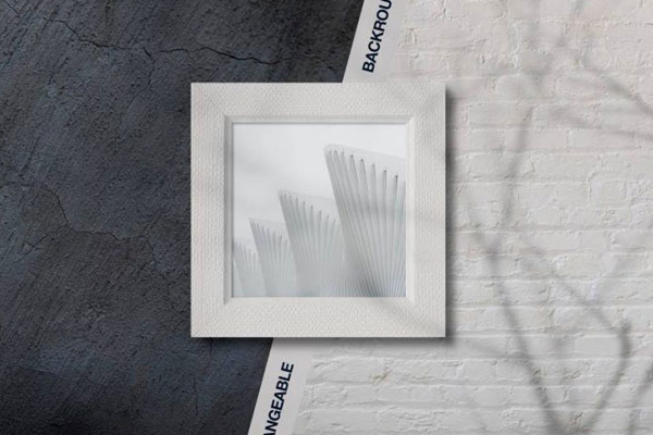 Overhead View of Square Picture Frame on Wall Background Mockup
