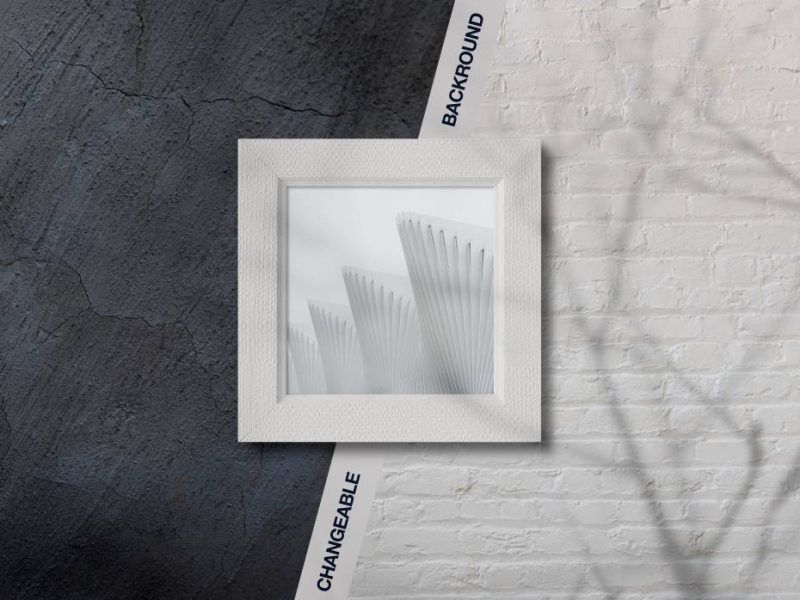 Overhead View of Square Picture Frame on Wall Background Mockup
