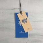 Overhead View of Two Cloth Tags on Wooden Surface Mockup