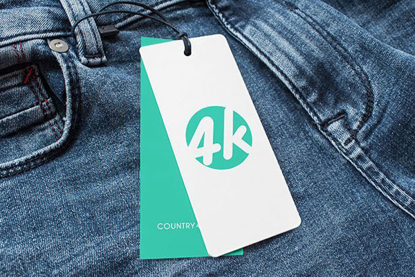Overhead View of Two Label Tags Attached to Jeans Mockup