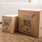 Packaging Boxes on Wooden Floor With Internal Design Mockup