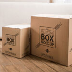 Packaging Boxes on Wooden Floor With Internal Design Mockup
