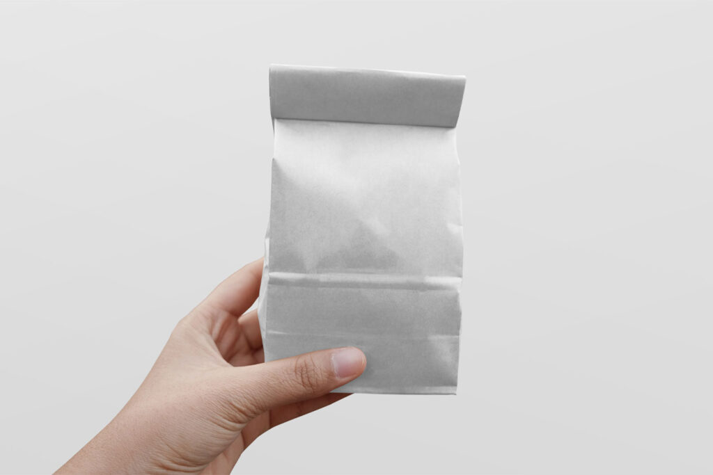 Paper Coffee Bag Mockup In Hand