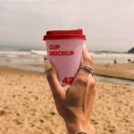 Paper Coffee Cup on the Beach Mockup