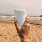 Paper Coffee Cup on the Beach Mockup