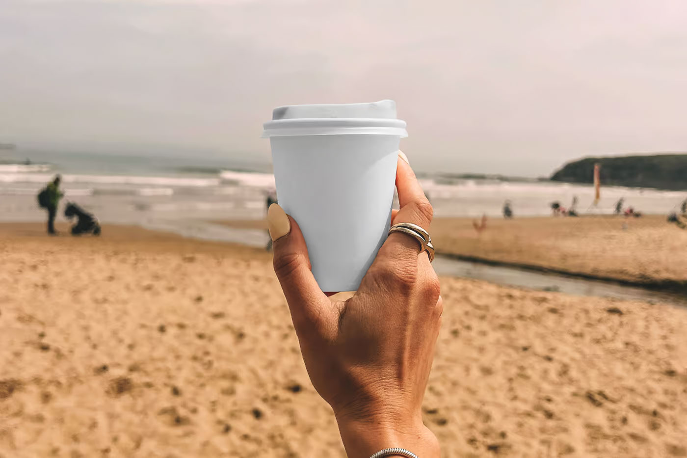 Free Paper Coffee Cup on the Beach Mockup PSD Template