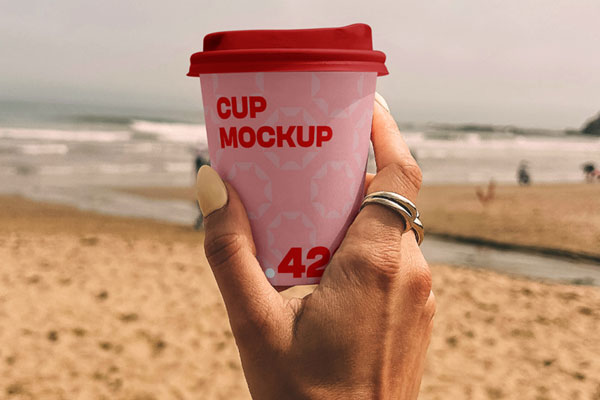 Paper Coffee Cup on the Beach Mockup