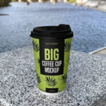 Paper Coffee Cup Standing in Front View by the Lake
