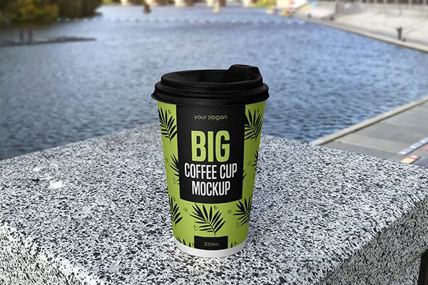Paper Coffee Cup Standing in Front View by the Lake