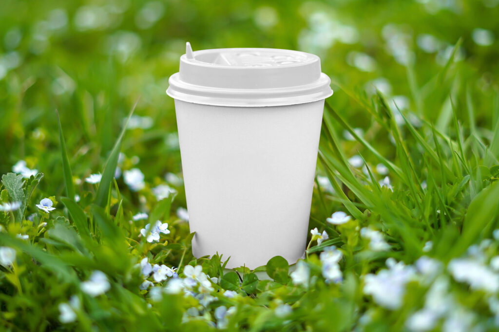 Paper Cup on Grass Mockup