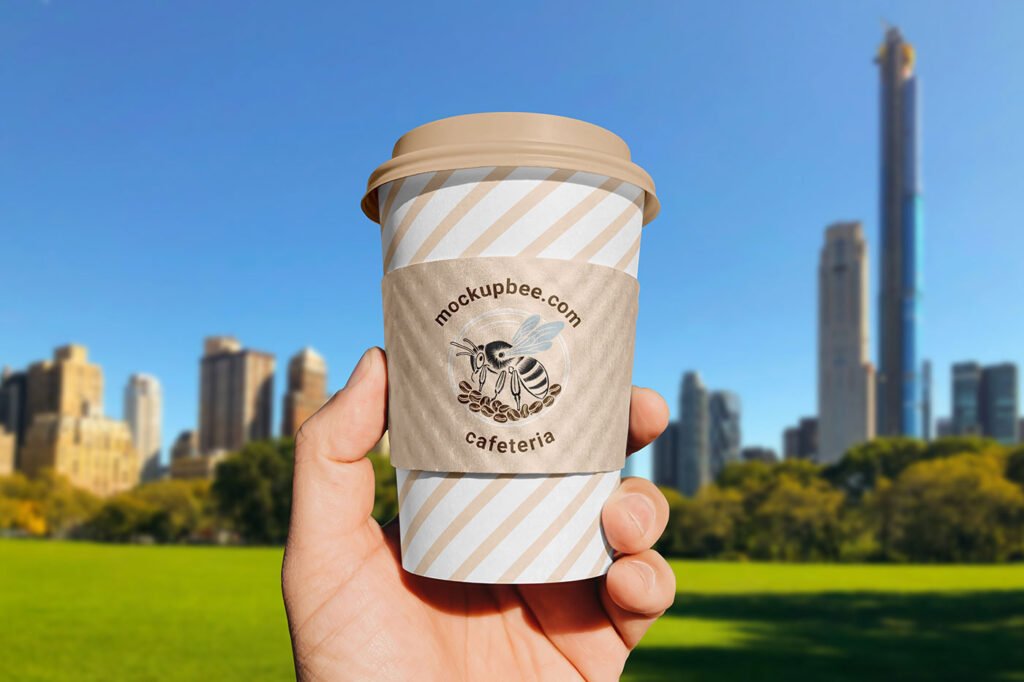 Paper Cup Sleeve in Hand Mockup