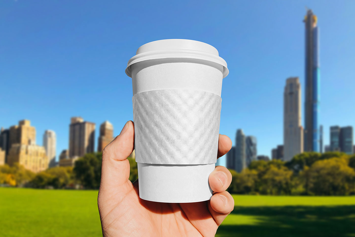 Free Paper Cup Sleeve in Hand Mockup PSD Template