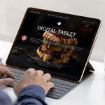 Person Working on Tablet with Keyboard Mockup