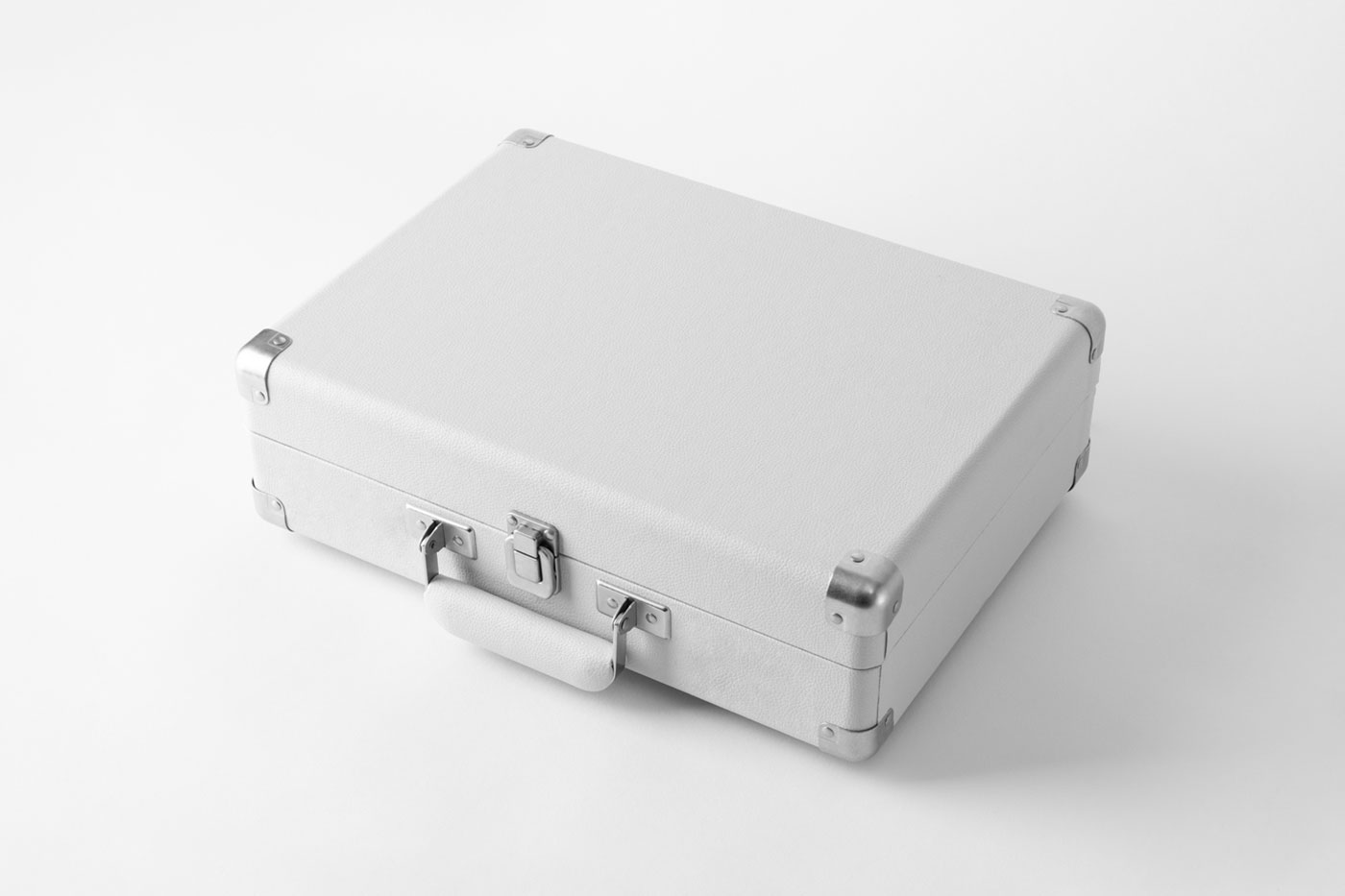 Free Perspective Shot of Lying Suitcase Mockup PSD Template