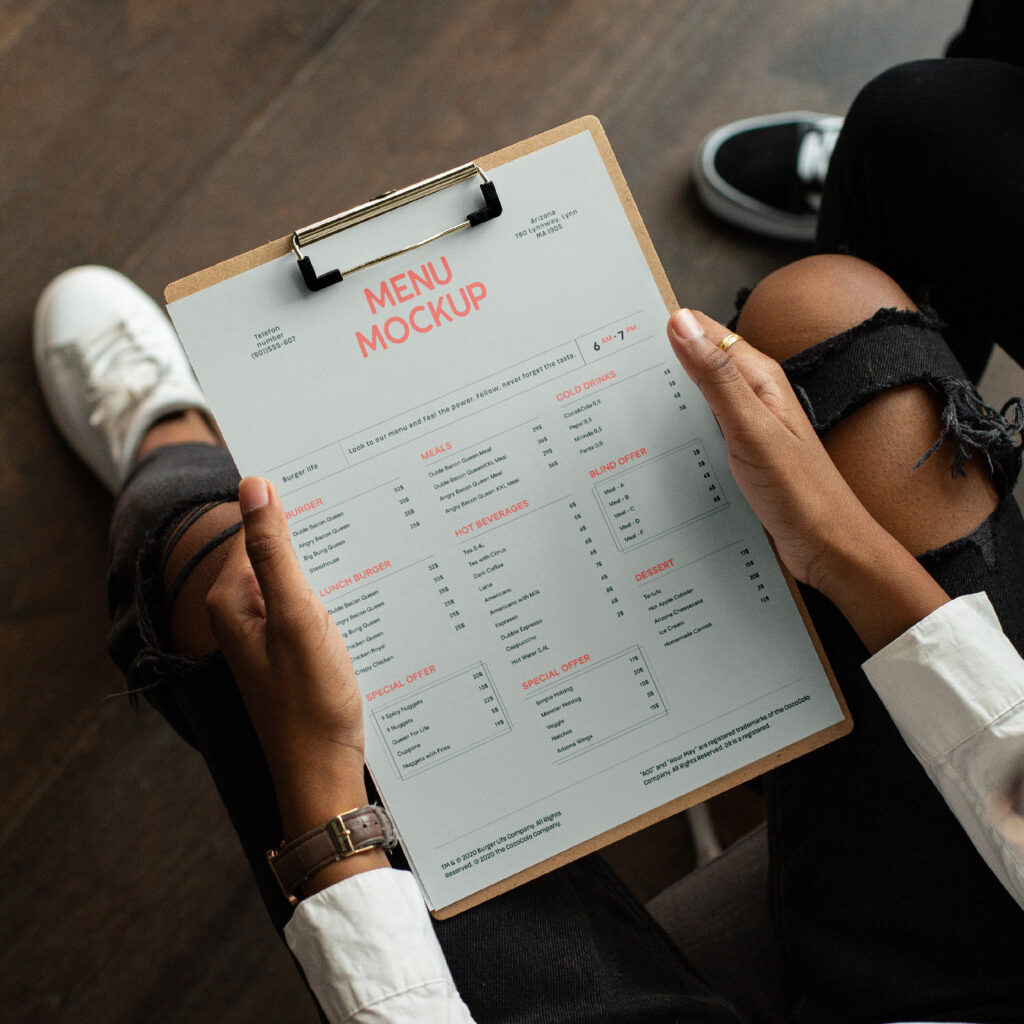 Perspective Showcase of Menu Mockup on Clipboard in Hands