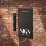 Perspective Sight of 2 Street Sign Mockups on Brick Wall