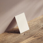 Perspective Sight of Business Card Mockup on Wood Table