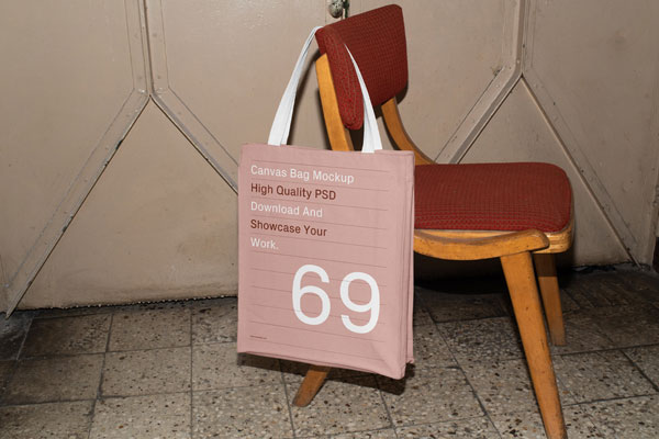 Perspective Sight of Canvas Bag Mockup Hanging on Chair