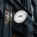 Perspective Sight of Circle Signboard Mockup on Building Wall