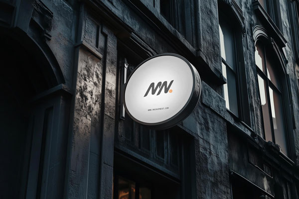 Perspective Sight of Circle Signboard Mockup on Building Wall