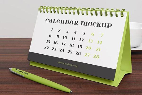 Perspective Sight of Desk Calendar Mockup with a Pen