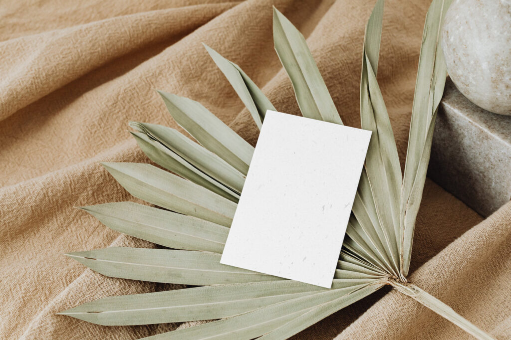 Perspective Sight of Eco Paper Card Mockup on Leaf