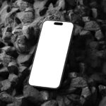 Perspective Sight of iPhone 15 Pro Mockup on Black Stone