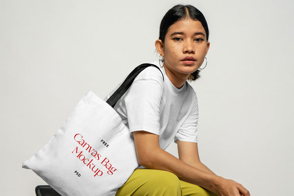 Perspective Sight of Sitting Woman Wears Canvas Bag Mockup