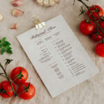 Perspective View A4 Menu Among Food Ingredients on Fabric Mockup