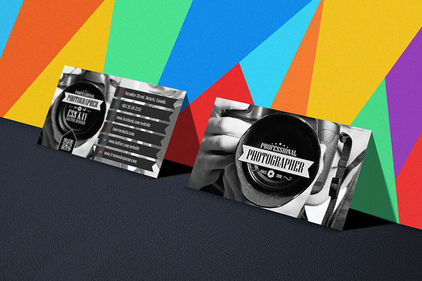 Perspective View Business Cards Leaning to a Colorful Wall Mockup