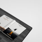 Perspective View Mockup of Open Book on Table Facing Down