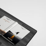Perspective View Mockup of Open Book on Table Facing Down