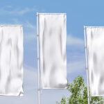 Perspective View of 3 Vertical Outdoor Wrinkled Pole Flags Mockup