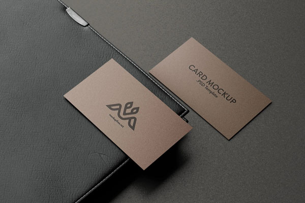 Perspective View of 5 Business Cards Mockups with Leather Cover Book