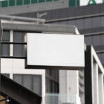 Perspective View of a Wall Mounted Shop Sign Mockup