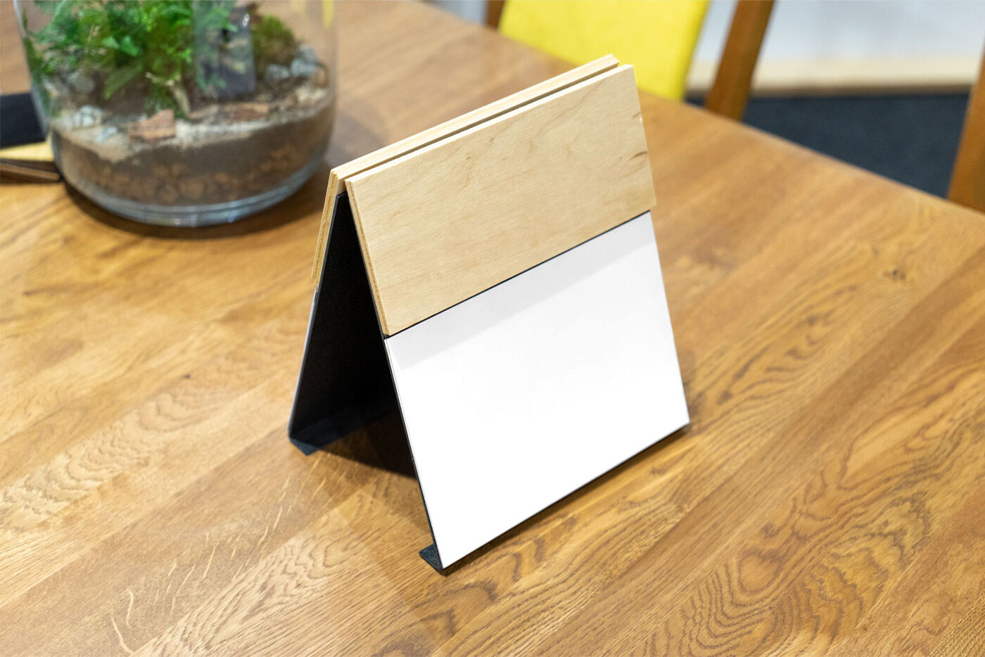 Perspective View of a Wooden Menu Mockup on Table FREE PSD