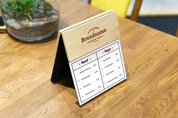 Perspective View of a Wooden Menu Mockup on Table