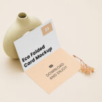 Perspective View of Bi-Fold Brochure Mockup with Vase