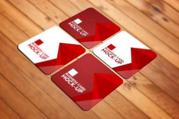 Perspective View of Four Square Business Cards on Wooden Texture Mockup