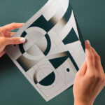 Perspective View of Glossy Paper Mockup in Hands