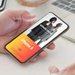 Perspective View of Hand Holding iPhone Five Mockup