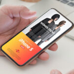 Perspective View of Hand Holding iPhone Five Mockup