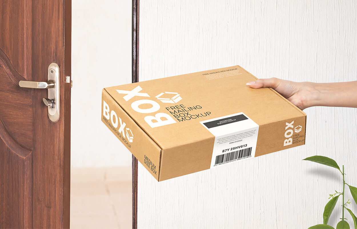 Perspective View of Hand Holding Mailing Box Mockup FREE PSD