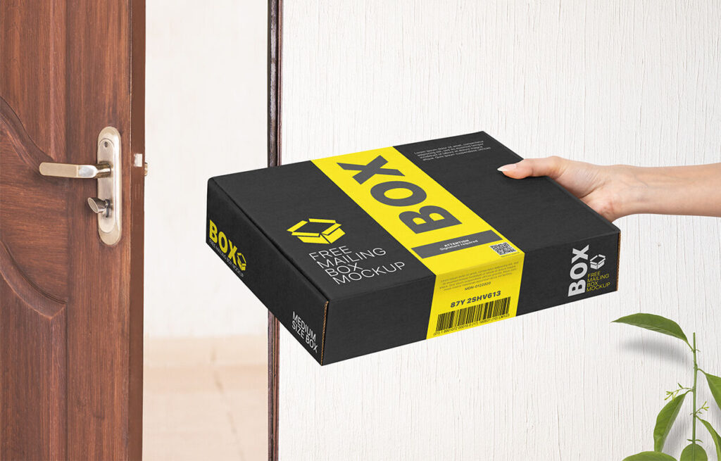Perspective View of Hand Holding Mailing Box Mockup